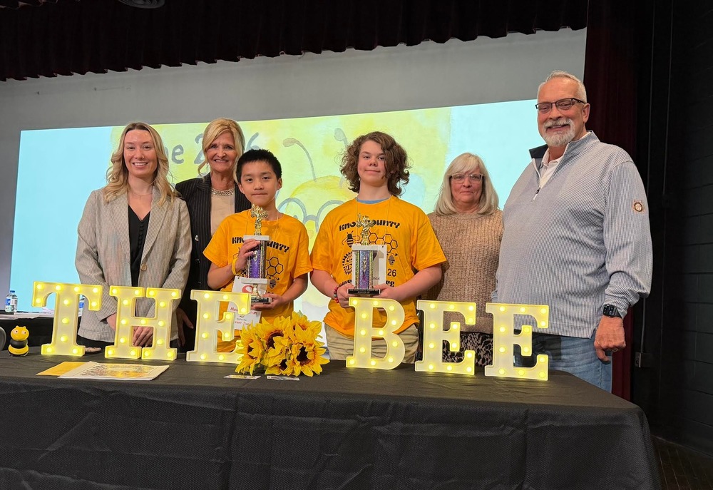 On stage at the conclusion of the 2026 Knox County Spelling Bee were, from left, Taylor Gingery, Knox ESC consultant; Commissioner Drenda Keesee; winner Vincent Jiang; runner-up Jace Daugherty; Knox Pages staff reporter Cheryl Splain, and Commissioner Barry Lester.
