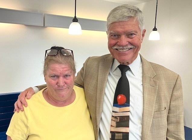 Superintendent Dr. Timm Mackley congratulates Michelle Kipp, a classroom aide at the Knox Learning Center, for her 25 years of service to the Knox Educational Service Center