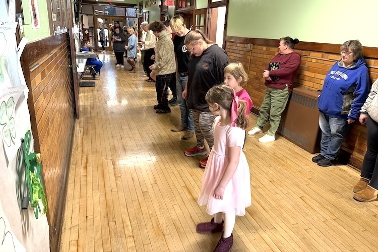 Students and staff at the Knox Learning Center prepare to dance to the Cha Cha Slide before the start of classes Wednesday