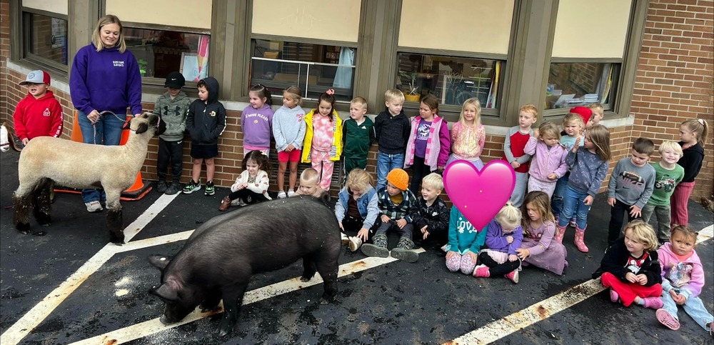 Preschool students interacted with a pig, goats and sheep outside their classrooms in the parking lot of the Centerburg Local Schools administration building.