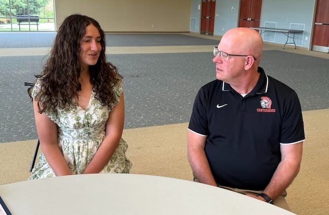 Allison Wilhelm talks with Centerburg High School Principal Brent Garee after the recent Russell B. Wise awards luncheon sponsored by the Kiwanis Club of Mount Vernon