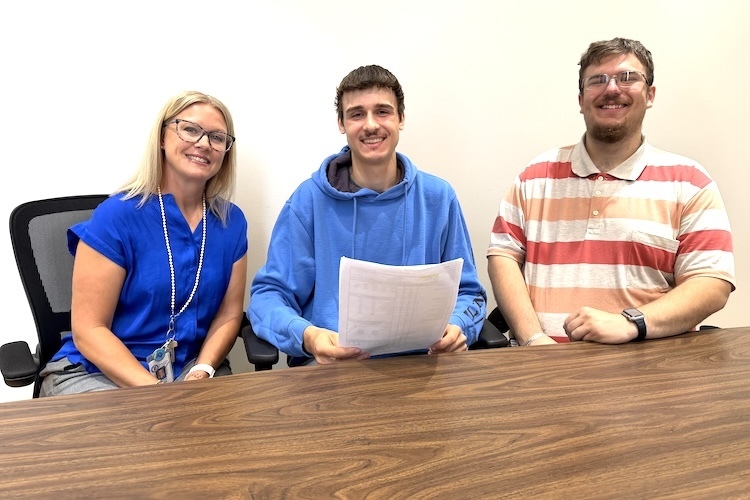 Danville High School senior Ethan Swendal is flanked by Dorothy Yoder, student success adviser, and Cory Myers, agriculture teacher and FFA adviser