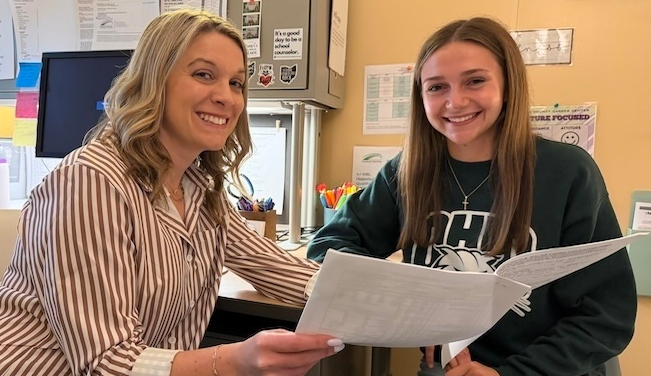 Katherine Bellman looks over her fall class schedule at Ohio University with KCCC guidance counselor Clarissa Bush
