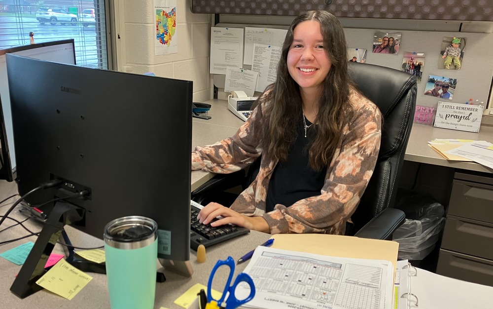 Lindsey Boeshart works at her desk as assistant treasurer of the Knox Educational Service Center