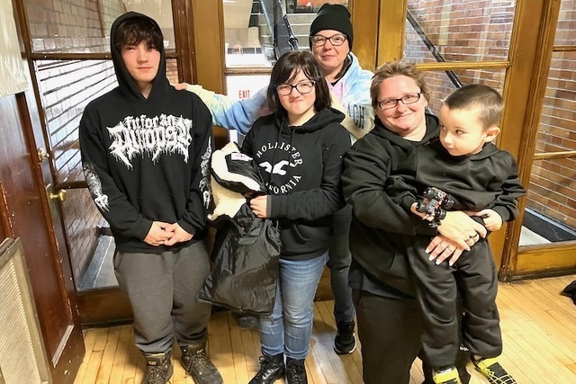 Gabriel Foote, left, was joined by his family Friday on his final day at the Knox Learning Center