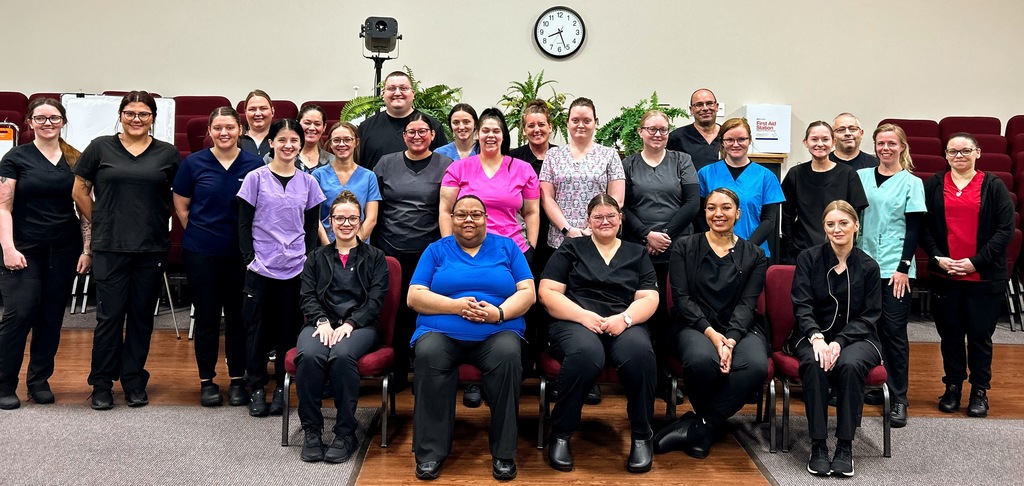 A group photo of 27 new practical nursing students.