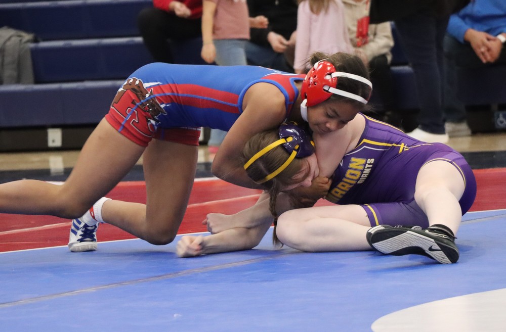 Spencer Martin competes against a Marion wrestler.