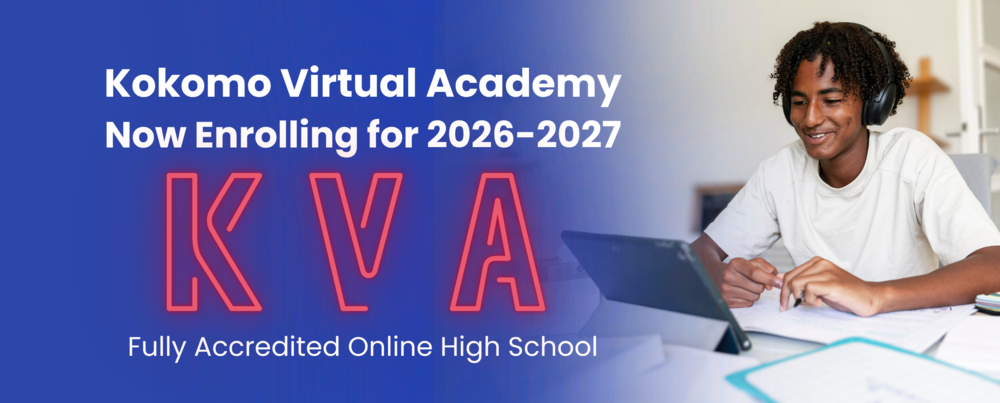 boy smiling happy facing laptop with school work on table