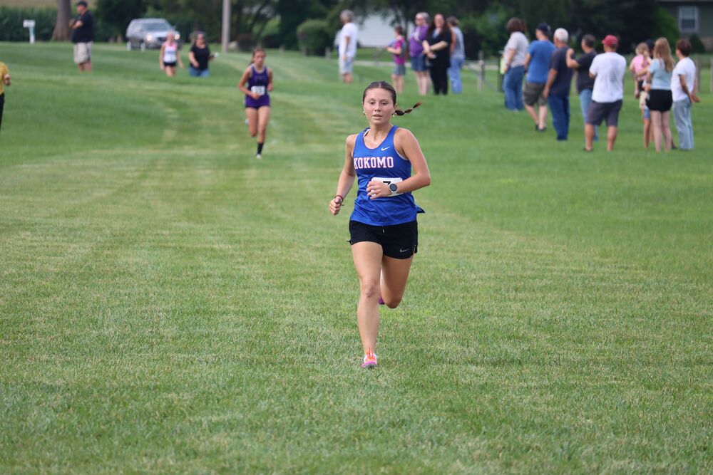 Junior Alaina Thompson races to the finish line at the Northwestern Combination. Thompson finished first at the meet.