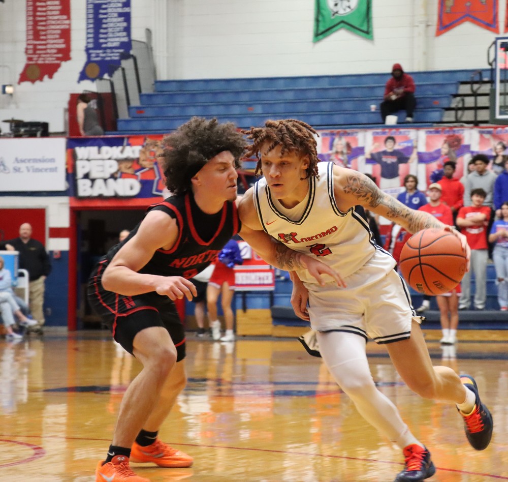 Senior Korbyn Hammel drives to the basket during the Kats senior night contest.