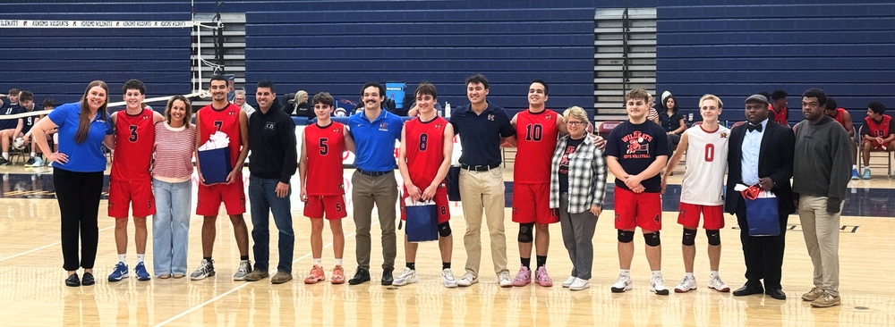 boys volleyball seniors celebrating final season with family and friend on the court