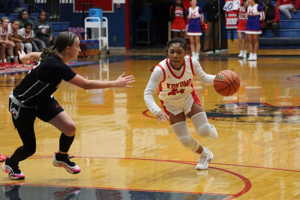 Junior Satyra Scott drives past her opponent.