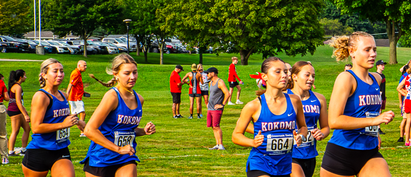 Members of the LadyKat cross country team warm up