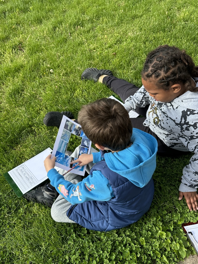 Students work together to learn about cloud formations.