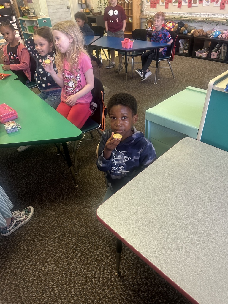 Students try dandelion jelly on a cracker.