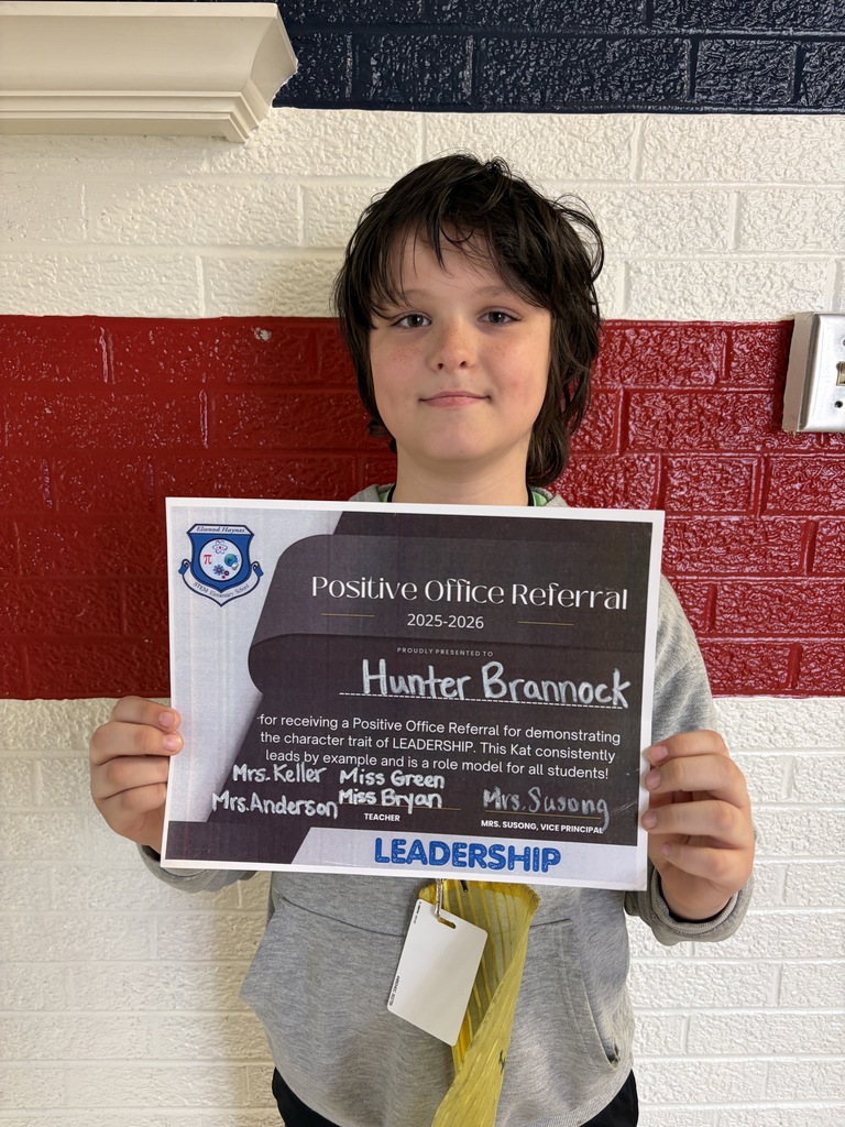 Students hold their positive office referral for May 2026.