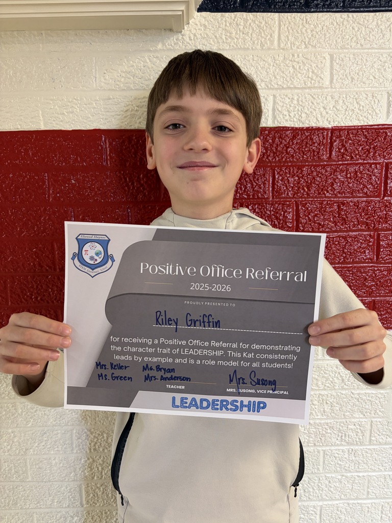 Students hold their positive office referral for May 2026.