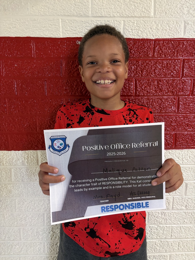 Students hold their positive office referral for May 2026.