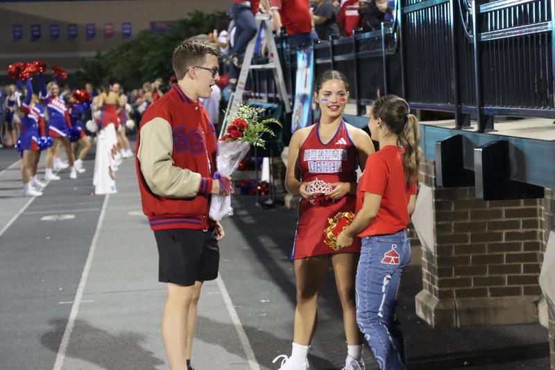 boy giving girl flowers