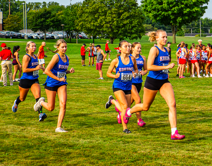 Members of the LadyKat cross country team warm up