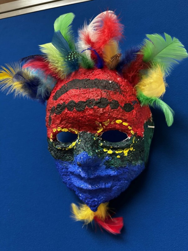 colorful mask artwork with feathers