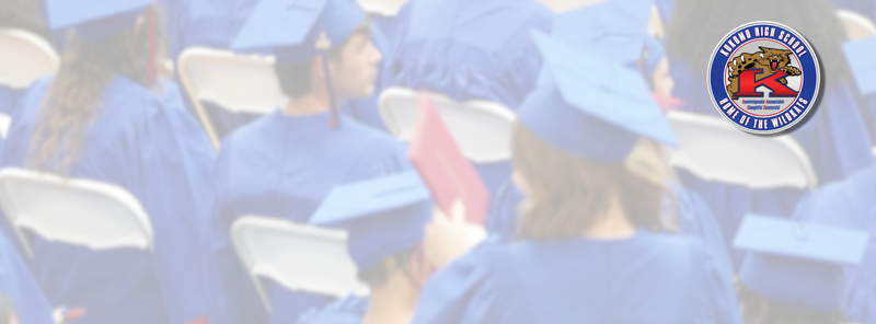 student in graduation cap and gown holding diploma