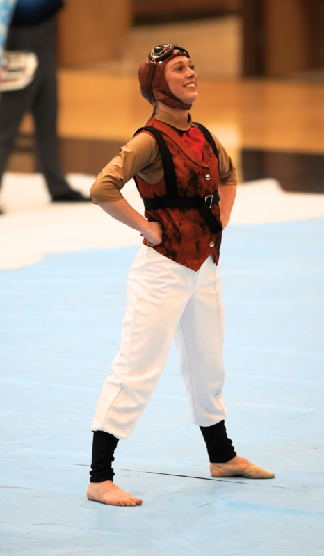 female student smiling with hands on hips and in Amelia  Earhart costume
