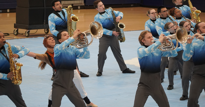 high school students performing with wind instruments