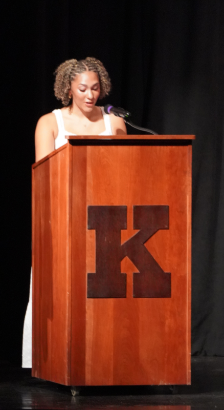 girl standing at podium