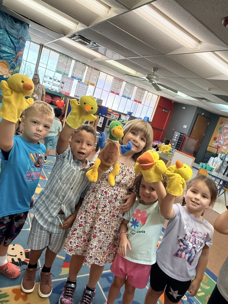 Pre-k acting out nursery rhymes using puppets