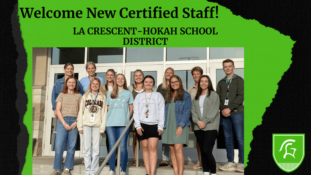 New Certified Staff group picture in front of glass doors