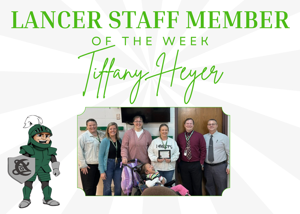 Picture of staff and student with framed certificate of staff of the week