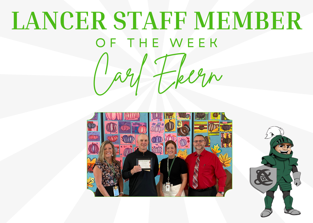 Staff of the week with Administration team, standing in front of students art work