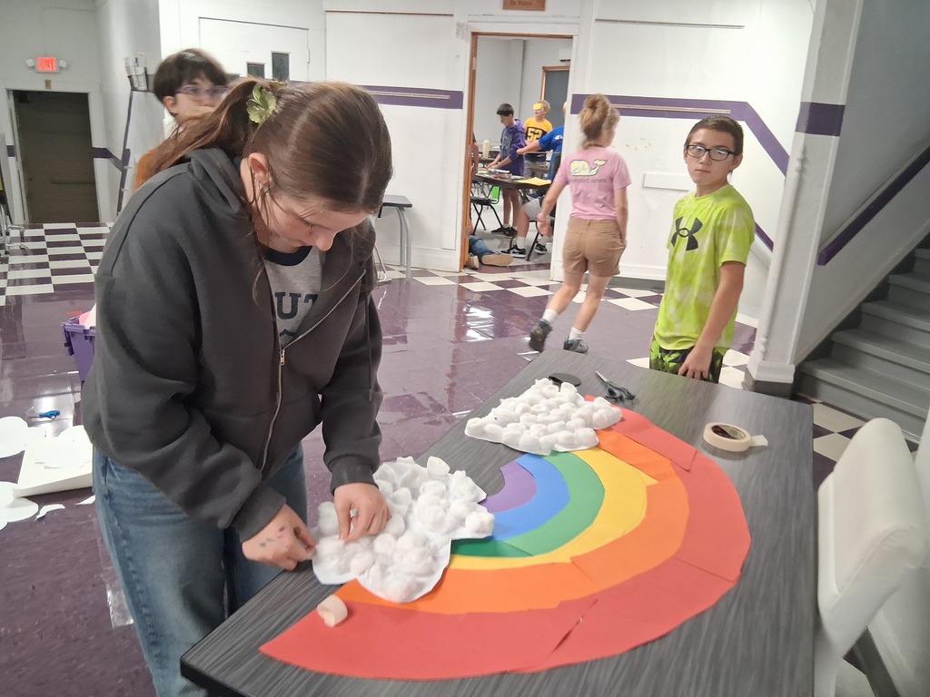 rainbow art with cotton ball clouds