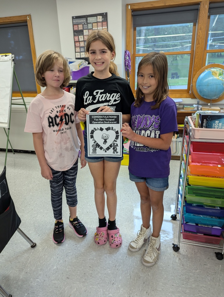 students holding certificate for beating escape room in time 