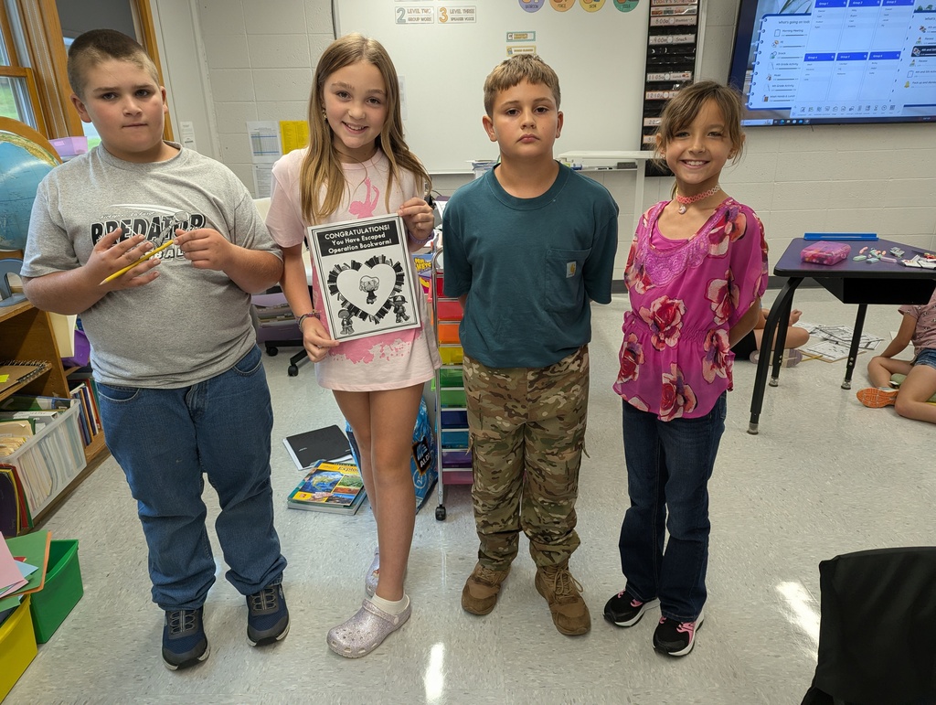 students holding certificate for beating escape room in time 