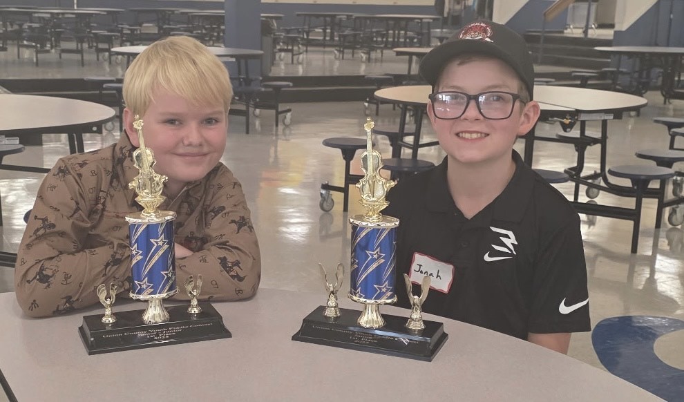 photo of two students who won fiddle awards