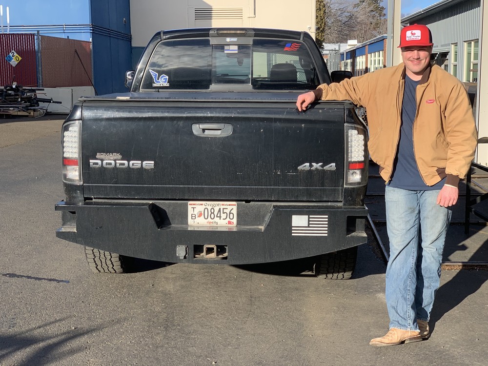 Image of Bekham Hibbert-and the  rear bumper project he built and installed, grade 11