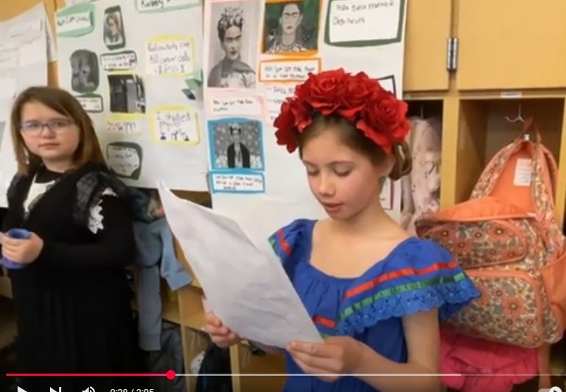 Two Central student presenting their Wax Museum people