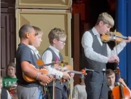 boys playing fiddle