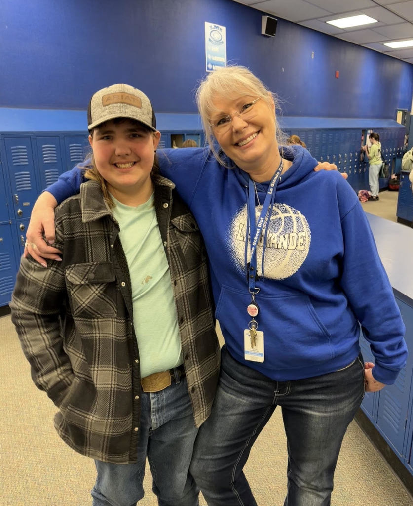 Student and teacher taking photo together