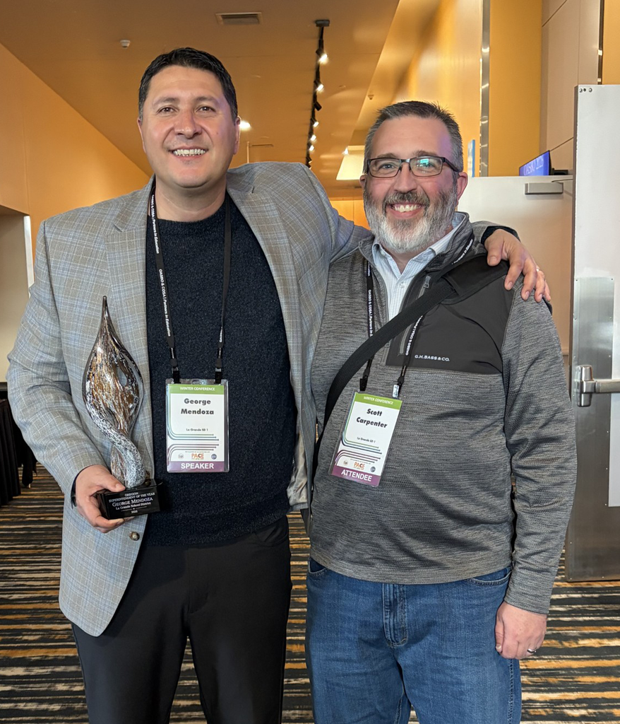 Mendoza and Scott Carpenter with award