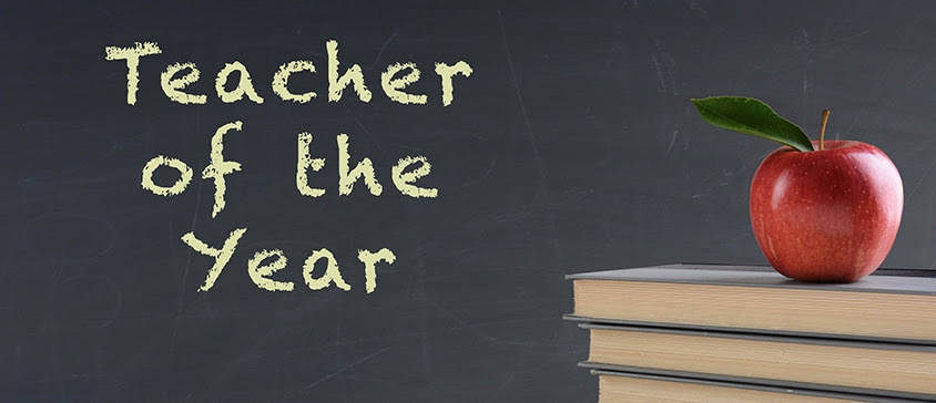 teacher of the year on a chalkboard and a stack of books with a red apple