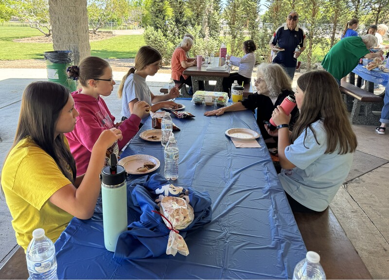 students and pen pals eating lunch