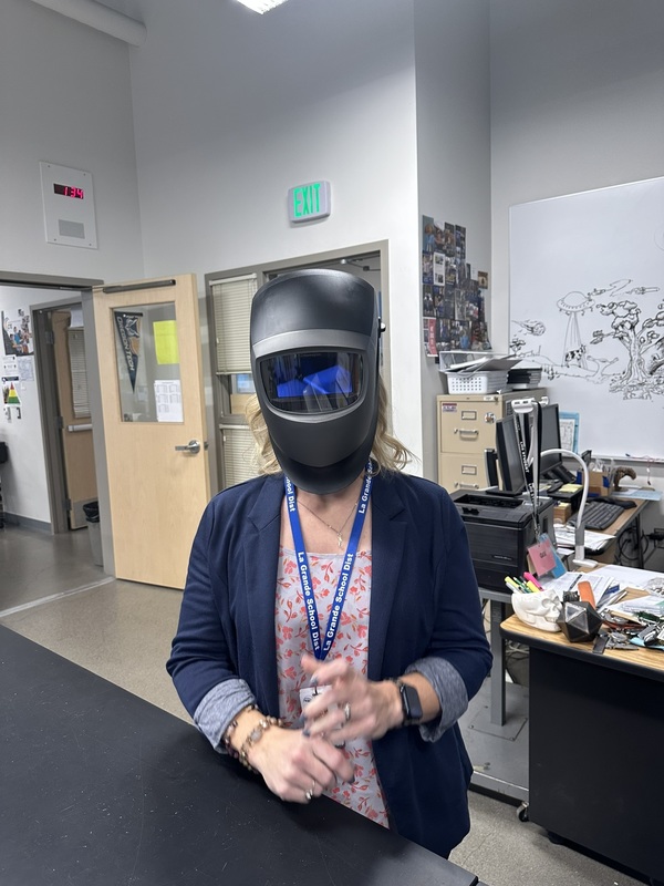 Mrs Hurliman modeling the new welding helmets