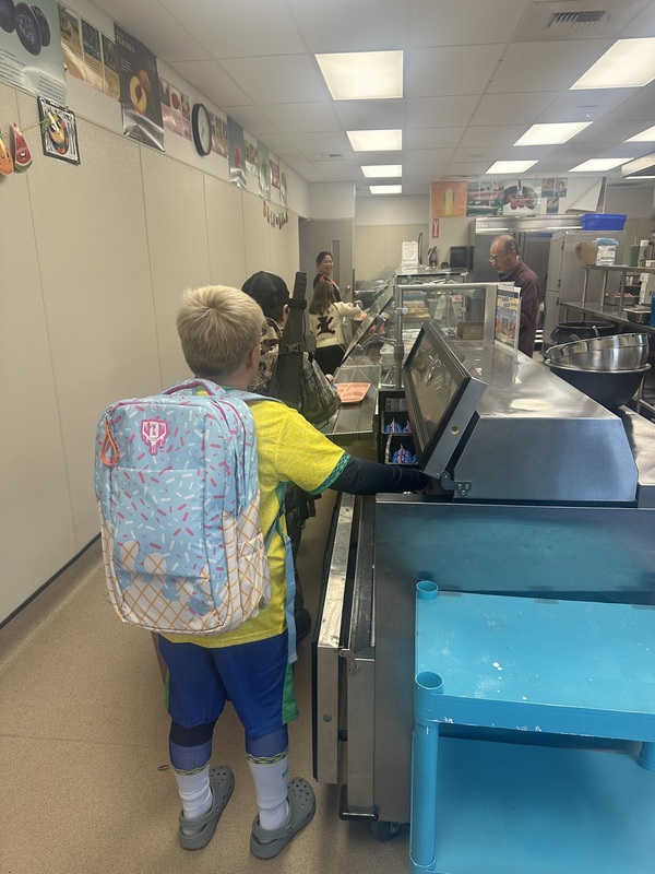 students in the line for pancakes