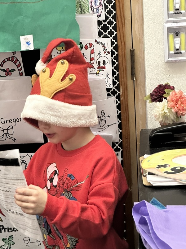 student in antlers hat