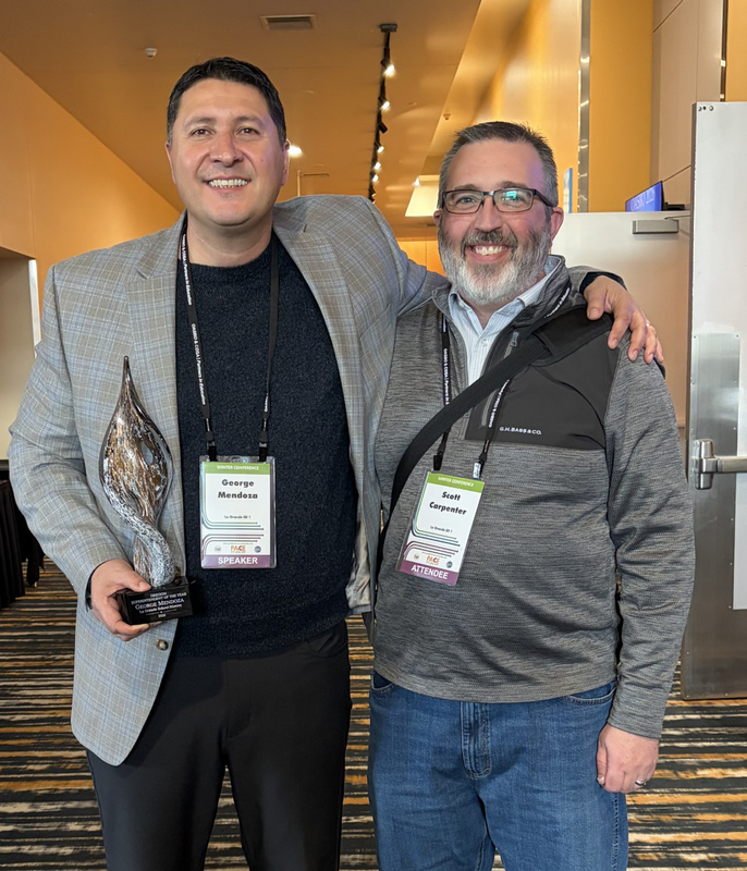 Mendoza and Scott Carpenter with Award
