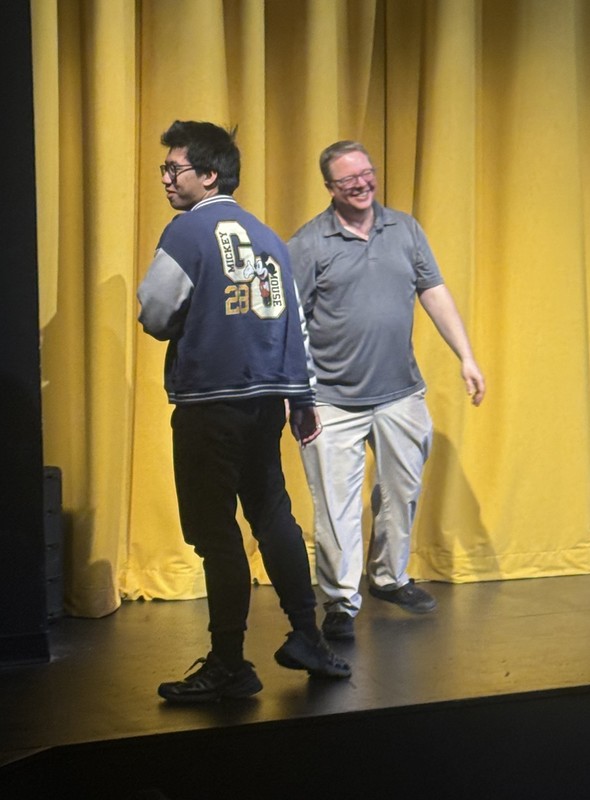 photo of student receiving a math award