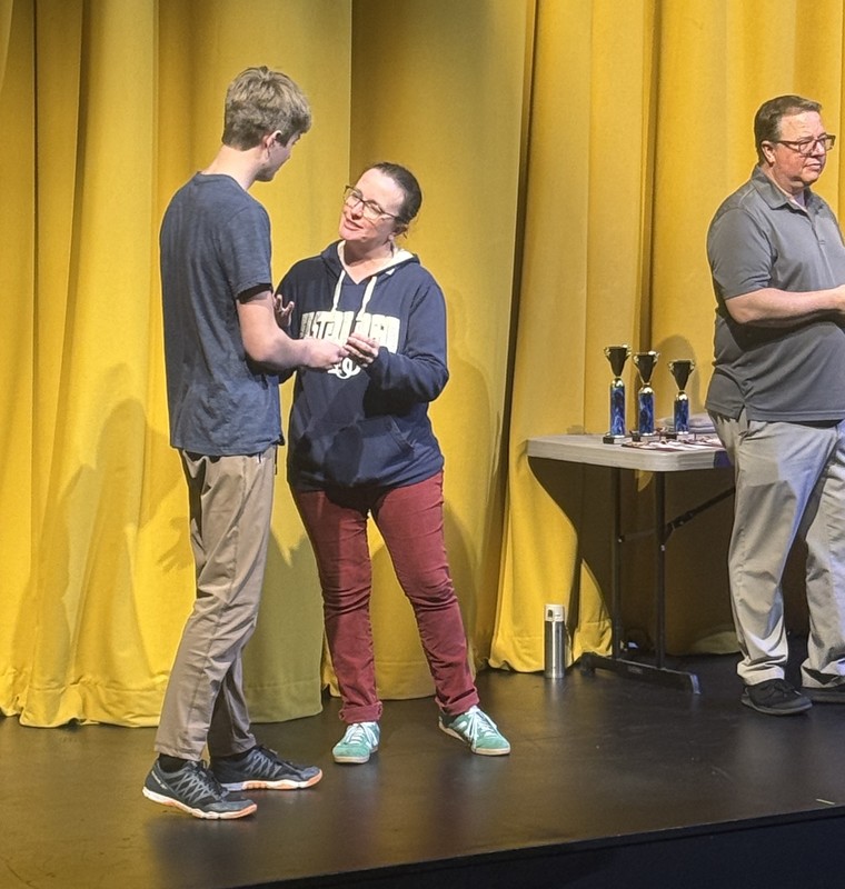 photo of student receiing a math award